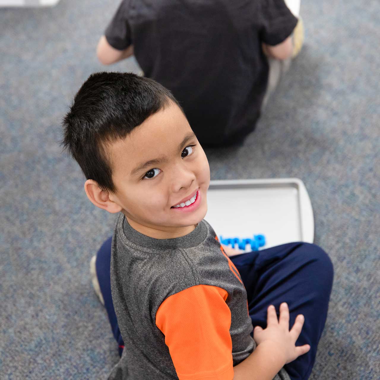 smiling-boy-spelling-square